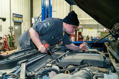 Karl GMC of Webster City technician performing service on a vehicle in the shop